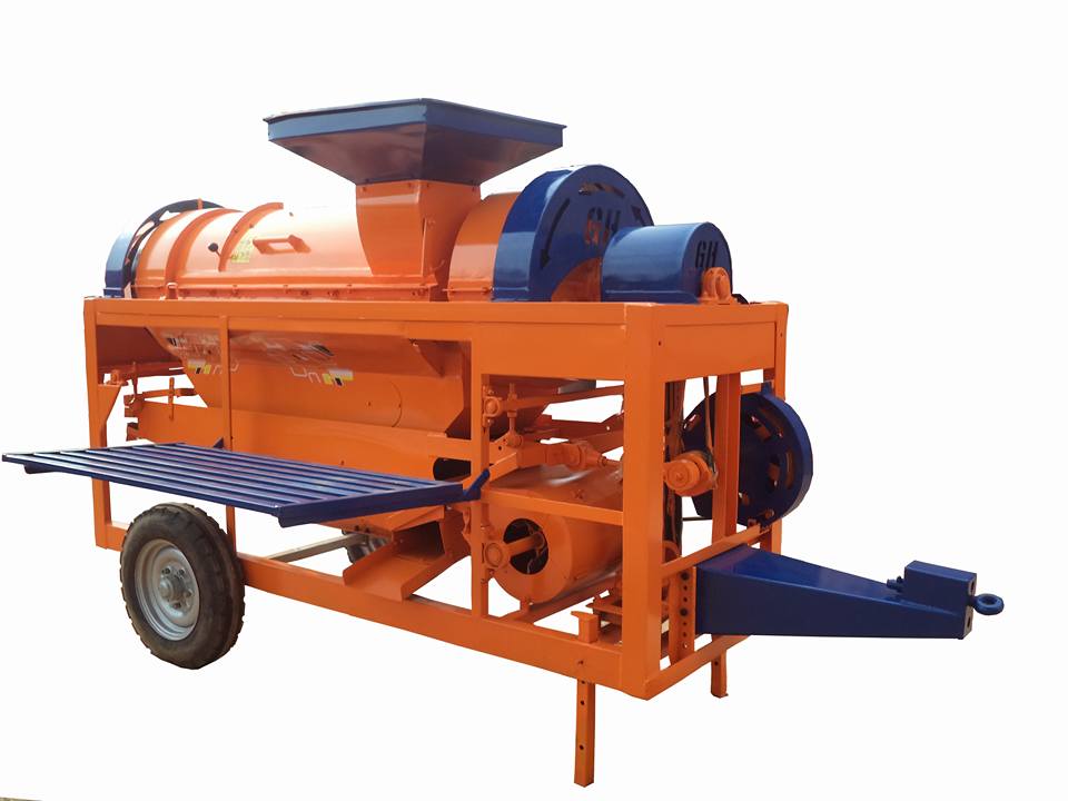 Maize thresher in action in a field